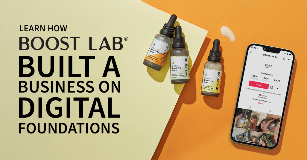 Boost Lab serums and a phone with Boost Lab's instagram account on the screen against an orange background.